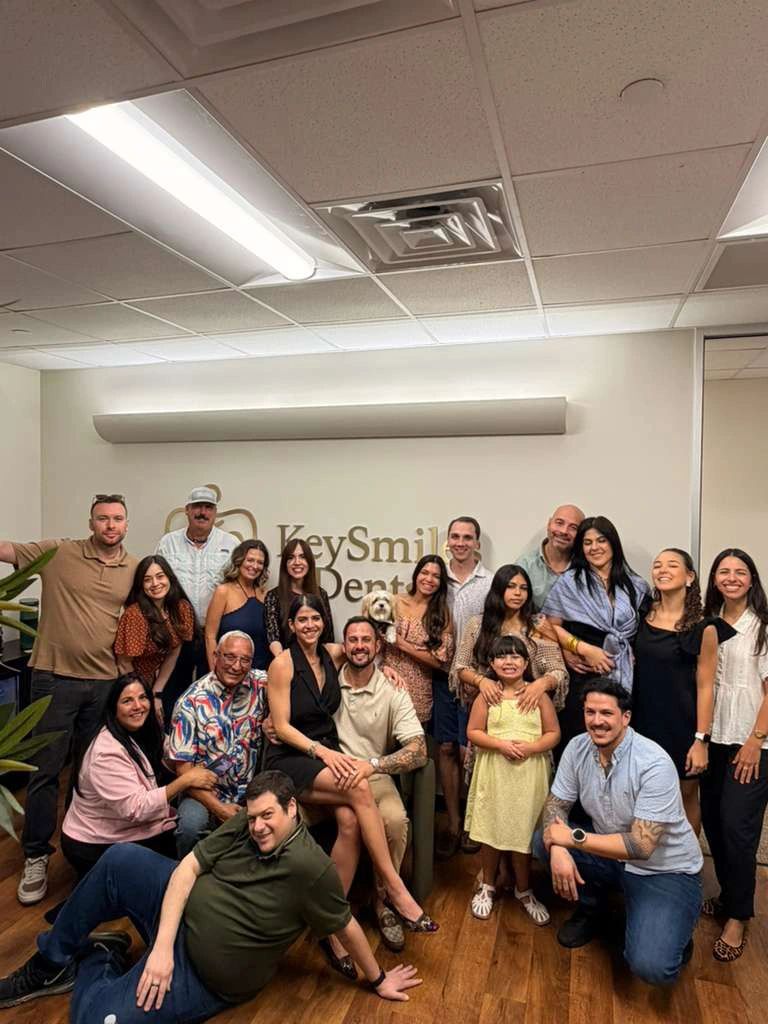 The KeySmiles Dental team and Dr. Escobar with patients in the Conroe office
